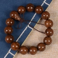 Detailed view of old-material sandalwood prayer beads on a traditional book background - Exquisite Small Hole / 15mm*15 Beads