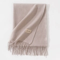 Light pink cashmere feel scarf with fringe tassels and woven brand label on plain surface - 70*200cm / Heather Cream