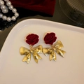 Close-up of velvet red rose earrings with golden bows on a white ceramic tray - 17# Silver Needle - Red - Flower Bow
