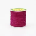 Close-up of 0.8mm rose red braided cord wound on a white spool for jewelry making - Color 129 Rose Red
