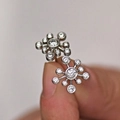 Pair of silver stud earrings featuring round-cut clear gemstones in a halo setting - Stud Earrings / White Gold