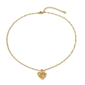Detailed shot of golden heart necklace with irregular texture and white zircon stone - Rhinestone Inlaid Irregular Textured Heart Necklace (N11769)