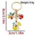 Christmas bear boot and snowflake keychain in KC gold finish with 9.4g weight detail - ER1775-Gift Box Snowflake Bear Note Keychain