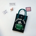 Black knitted phone bag with coffee time pattern and dark teal handles on white background - Coffee Black