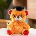 Close-up of graduation teddy bear with black academic cap and diploma model detail - Brown Graduation Bear