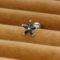 Detail view of flower stud earring with black marquise stones on brown velvet display - Silver/Black Zirconia