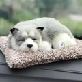 Realistic sleeping husky plush toy on a soft beige faux fur rug in a natural setting - Large Husky Dog