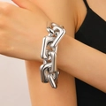 Close-up of chunky silver rectangle chain bracelet in polished industrial punk style - Gold Rectangular Link Bracelet (8301)