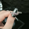 Pink gemstone butterfly ring with silver twist band shown on finger - Style 9-Pink Zirconia Bowknot