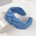 Solid blue fabric knotted headband displayed on a ceramic cup with a white background - Blue 17.5CM