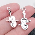 Antique silver violin pendants set on palm showing fine musical instrument details - Violin (14x23mm-1.2g)
