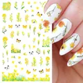 Close-up of yellow tulip and butterfly nail art stickers on milky white manicure - F1035 (Yellow Rapeseed Flower)