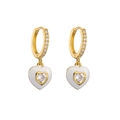 Macro detail of gold-plated heart earrings with white enamel and sparkling zircon stones - White Heart
