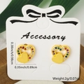 Gold heart stud earrings with multi-colored cubic zirconia on a white jewelry card - Double Heart Style