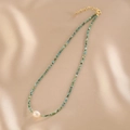 Double layered necklace with turquoise beads and a white freshwater pearl centerpiece - Turquoise