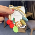 Plush bow hair tie with cherry charm and green tag featuring 'Come with me' text - Beige Cherry Decoration