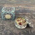 Scented soy candle in a blue mandala tin with dried petals and matching gift box packaging - Violet (Tin)