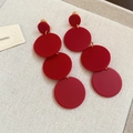 Macro view of long vibrant red four-tier acrylic drop earrings on a textured fabric - 107# Four Circles Long Dangle (Ear Clip) / Red