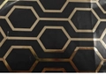 Black gift wrapping paper featuring golden metallic honeycomb geometric patterns - Black and Gold Geometric