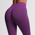 Detail view of purple high-waisted seamless yoga pants featuring peach butt lift design - Plum Purple
