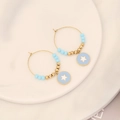 Golden earrings with blue star charms and beads on a ceramic plate, minimalist style - Five-pointed Star Style (4#五角星)