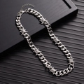 Detail of silver thorn Cuban link necklace with barbed wire knots on a dark background - 40CM / Silver Necklace