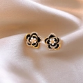Detailed close-up of camellia-shaped enamel earrings resting on soft beige silk fabric - 11# Camellia Zirconia Rhinestone Stud Earrings
