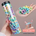 100-piece set of small seamless pastel hair ties in a transparent cylinder container - Spring Colors 100Pcs/Jar