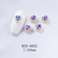 Macro detail of 7.5x8mm champagne pink aurora heart nail charms with pearls - Pink Purple Heart (8602 Starry Pink Purple)