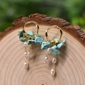 Vintage style gold earrings with natural white pearl and turquoise stone on wood - Turquoise
