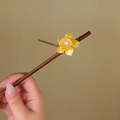 Detailed view of wood hair pin featuring yellow resin flower and white pearl accents - Glazed Yellow Flower (S390)