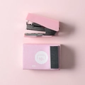 Mini pink stapler set with 10# staples and packaging box on a pink background - Sakura Pink