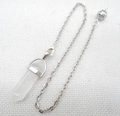 Macro shot of white crystal hexagonal prism pendant with a silver filigree ball chain - White Crystal