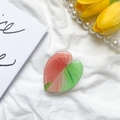 Close-up of heart-shaped leaf phone grip with red and green glossy glaze on white fabric - Leaf Holder - Style 8
