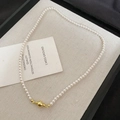 Detailed close-up of a white pearl beaded necklace featuring a polished gold ball clasp - 57# Gold White 4mm Magnetic Pearl Necklace