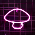 Pink glowing mushroom neon light sign hanging on a white wall grid for cozy room decor - Pink