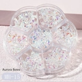 Detailed close-up of Aurora resin bow nail charms in a flower-shaped storage container - MH-15 Various Bows