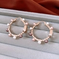 Macro detail of 18K gold plated hoop earrings with white and pink pearls in a jewelry box - Pig Nose Hoop Pearl Earrings - Light Coffee Gold - Purple - Champagne