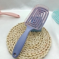 Ergonomic purple vented hairbrush with pink ball-tip bristles for scalp massage - Purple