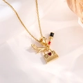 Detail of gold charms featuring a stiletto heel, lipstick, and shopping bag with red gem - Gold High Heels Bag Style