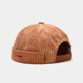 Detail of corduroy docker hat with a red fish embroidery and brown leather back strap - Camel