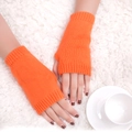 Thick knitted fingerless gloves in bright orange for winter warmth and fashion - One Size / Orange