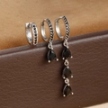 Detail of silver drop earrings set with micro-inlaid black zircon on leather box - Silver-Black