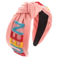 Dettaglio fascia per capelli rosa annodata con ricamo LOVE di perline colorate in cotone - Rosa