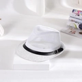 Detail of white mesh fedora hat with black leather band and metal buckle on magazines - White