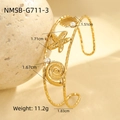 Detail view of gold ocean-style cuff bracelet with shell, starfish and pearl accents - Gold Shell Starfish Pearl Open Bangle