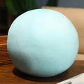 3D round Earth plush pillow in light blue color placed on a wooden table in home setting - Keychain 7.5cm / Uranus
