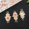 Three gold Hamsa Hand connectors with blue evil eye heart and clear rhinestones - KC Gold Evil Eye 12x22mm