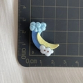 Detail view of wave and cloud resin accessories on a measurement grid for DIY projects - Blue Sea Wave
