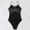 Detail of cross-back straps with leopard print and metal ring on black swimsuit - S / Black